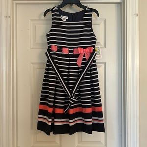 Girls size 12 Dark Blue and White striped dress with bows and strap.